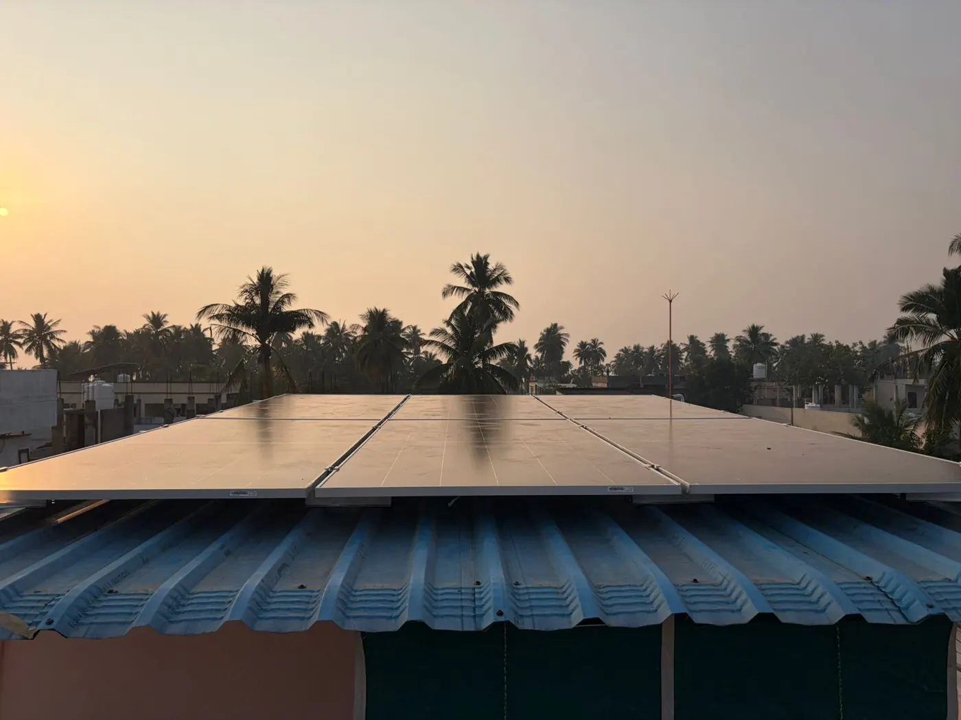 Residential solar rooftop AP project with panels at sunset